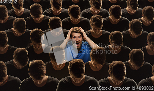 Image of Top view of grey crowd of identical people and special one man, difference and diversity concept