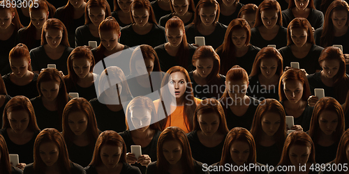 Image of Top view of grey crowd of identical people and special one woman, difference and diversity concept