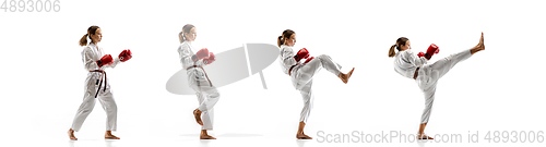 Image of Confident junior in kimono practicing taekwondo combat, martial arts