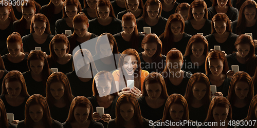 Image of Top view of grey crowd of identical people and special one woman, difference and diversity concept