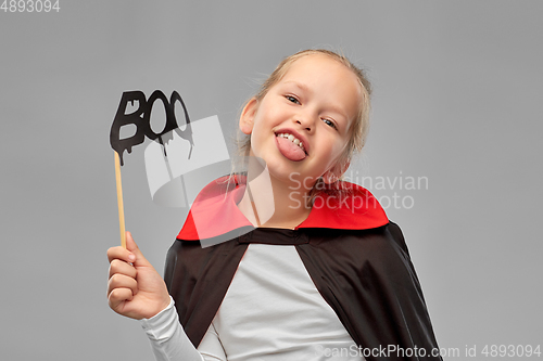 Image of girl in costume of dracula with cape on halloween