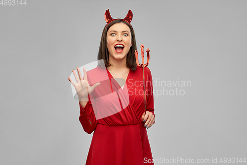 Image of scary woman in red halloween costume of devil