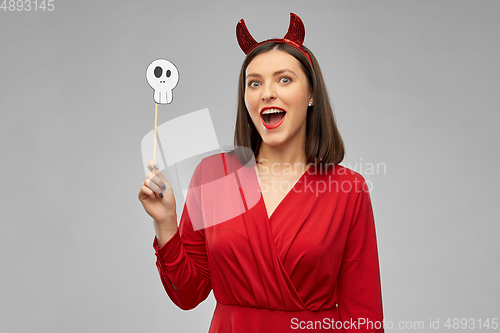 Image of happy woman in red halloween costume of devil