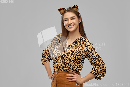 Image of happy woman in halloween costume of leopard