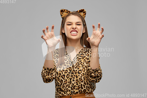 Image of happy woman in halloween costume of leopard