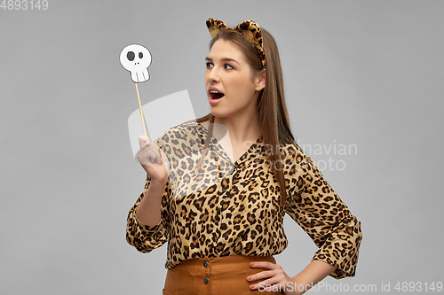 Image of surprised woman in halloween costume of leopard