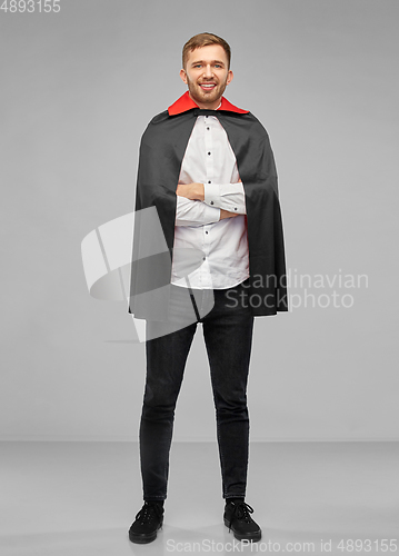 Image of happy man in halloween costume of vampire