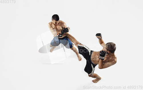 Image of Two professional MMA fighters boxing isolated on white studio background, dynamic and motion. Top view