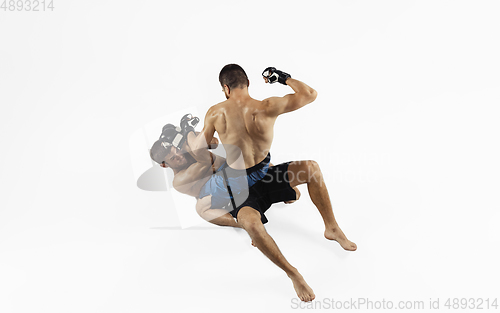 Image of Two professional MMA fighters boxing isolated on white studio background, dynamic and motion. Top view