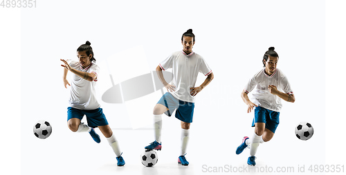 Image of Confident football player in motion and action isolated on white background, kicking ball in dynamic