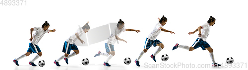 Image of Confident football player in motion and action isolated on white background, kicking ball in dynamic
