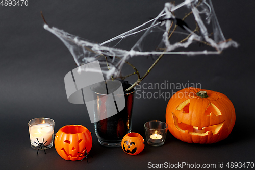 Image of pumpkins, candles and halloween decorations