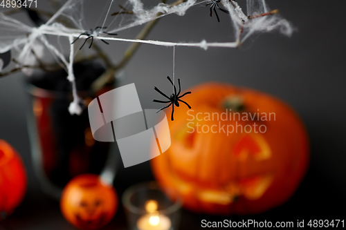 Image of pumpkins, candles and halloween decorations