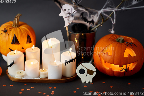 Image of pumpkins, candles and halloween decorations