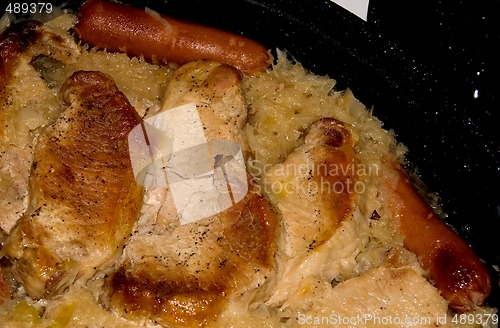 Image of Sauerkraut And Meats In A Baking Pan