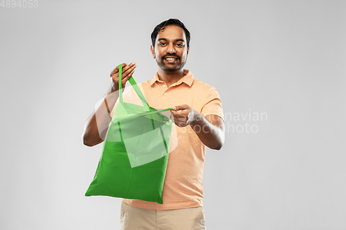 Image of man with reusable canvas bag for food shopping