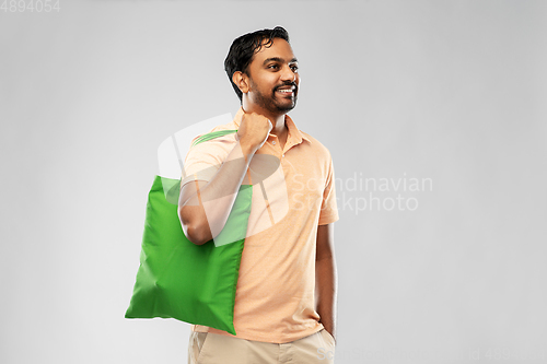 Image of man with reusable canvas bag for food shopping