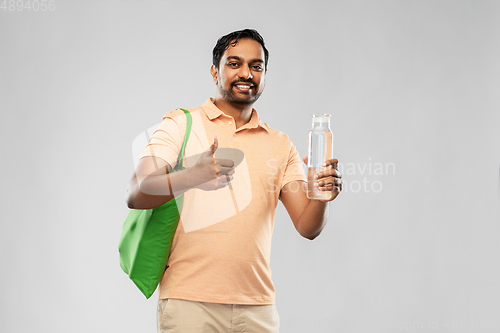 Image of man with bag for food shopping and glass bottle