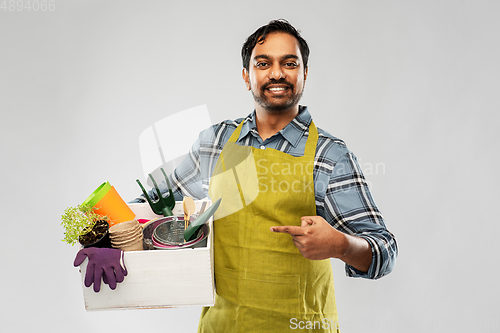 Image of indian gardener or farmer with box of garden tools