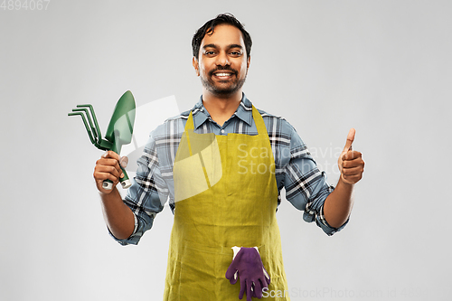 Image of indian gardener or farmer with box of garden tools