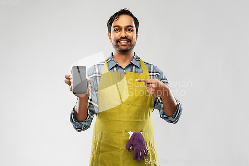 Image of indian male gardener or farmer with smartphone