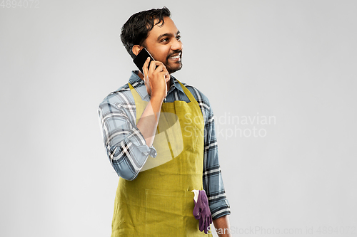 Image of indian gardener or farmer calling on smartphone