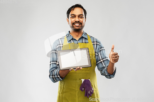 Image of indian male gardener or farmer with tablet pc
