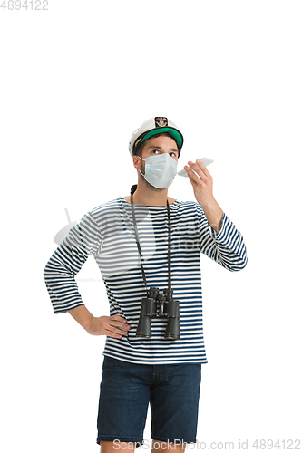 Image of Caucasian male sailor in uniform isolated on white studio background