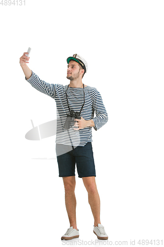 Image of Caucasian male sailor in uniform isolated on white studio background