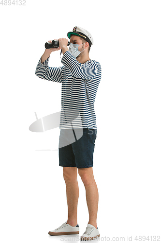 Image of Caucasian male sailor in uniform isolated on white studio background