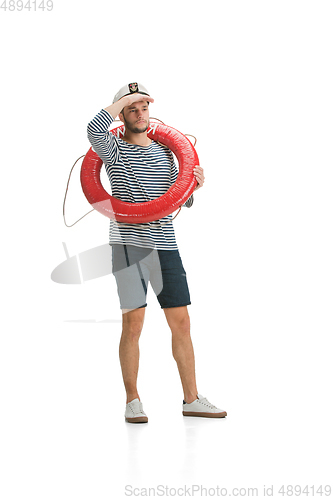 Image of Caucasian male sailor in uniform isolated on white studio background