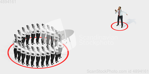 Image of Studio shot of people demonstrating social distancing with arrows indicating the separation.
