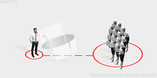 Image of Studio shot of people demonstrating social distancing with arrows indicating the separation.