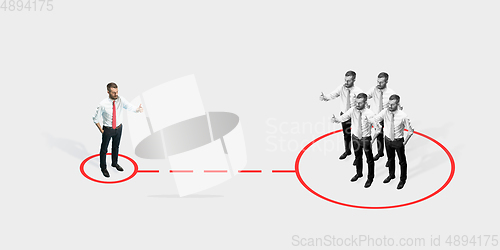 Image of Studio shot of people demonstrating social distancing with arrows indicating the separation.