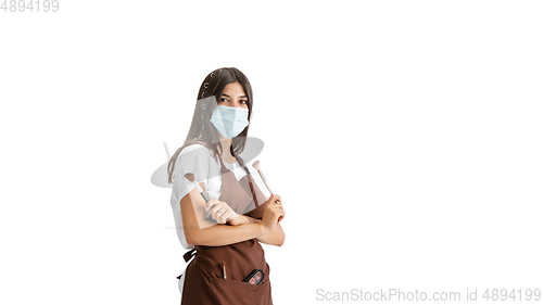 Image of Young woman, visagiste with cosmetics isolated on white studio background