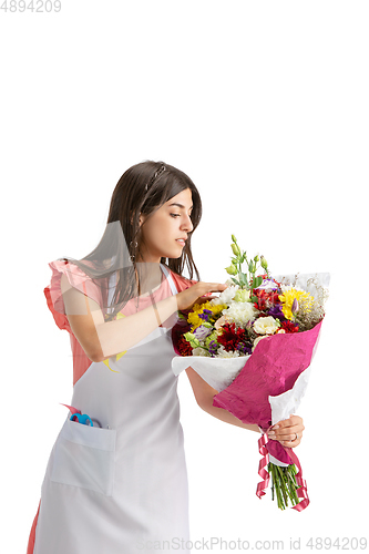 Image of Young woman, florist with bouquet isolated on white studio background