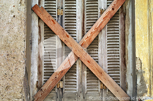 Image of boarded up window shutter