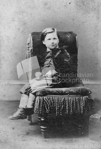 Image of portrait of boy on chair