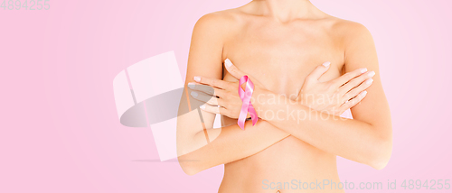 Image of woman with pink breast cancer awareness ribbon