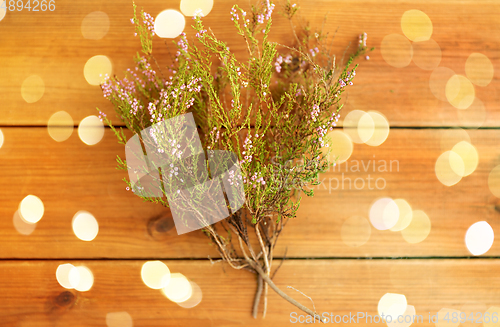 Image of heather bush on wooden table