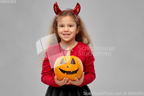 Image of girl in halloween costume with jack-o-lantern