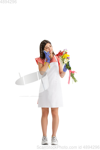Image of Young woman, florist with bouquet isolated on white studio background