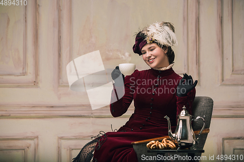 Image of Modern trendy look of Portrait of an Unknown Woman. Retro style, comparison of eras concept.