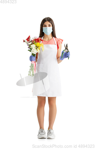 Image of Young woman, florist with bouquet isolated on white studio background