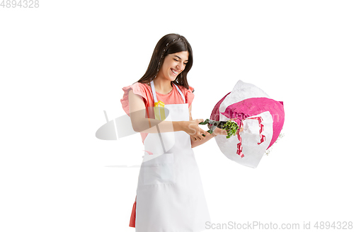 Image of Young woman, florist with bouquet isolated on white studio background