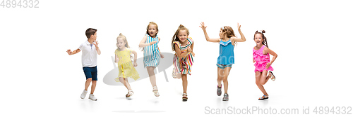 Image of Happy little caucasian kids jumping and running isolated on white background