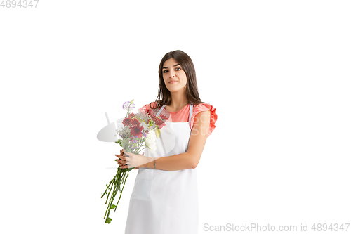 Image of Young woman, florist with bouquet isolated on white studio background