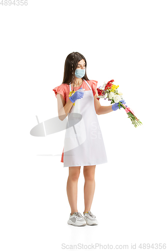 Image of Young woman, florist with bouquet isolated on white studio background