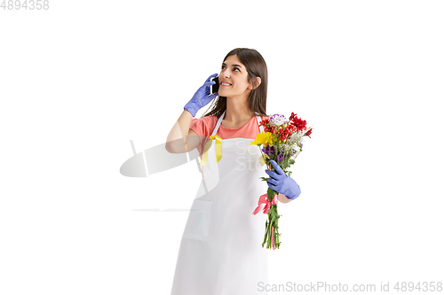 Image of Young woman, florist with bouquet isolated on white studio background