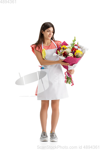 Image of Young woman, florist with bouquet isolated on white studio background